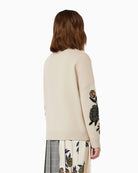 Back view of ecru wool jumper showing wide fit and ribbed hem