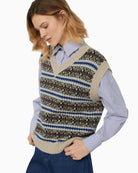 Close-up of jacquard knit texture in soft ecru tones