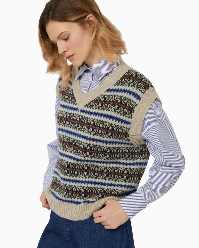 Close-up of jacquard knit texture in soft ecru tones