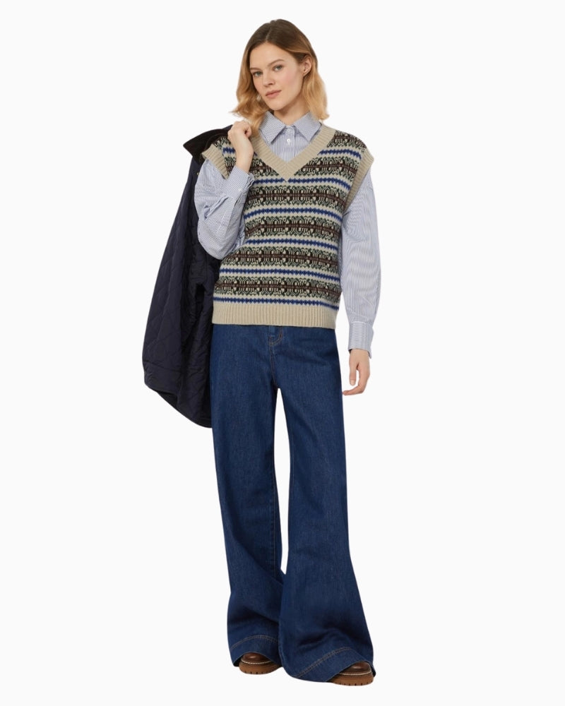 Fleres sleeveless jumper styled over a shirt for a smart casual look