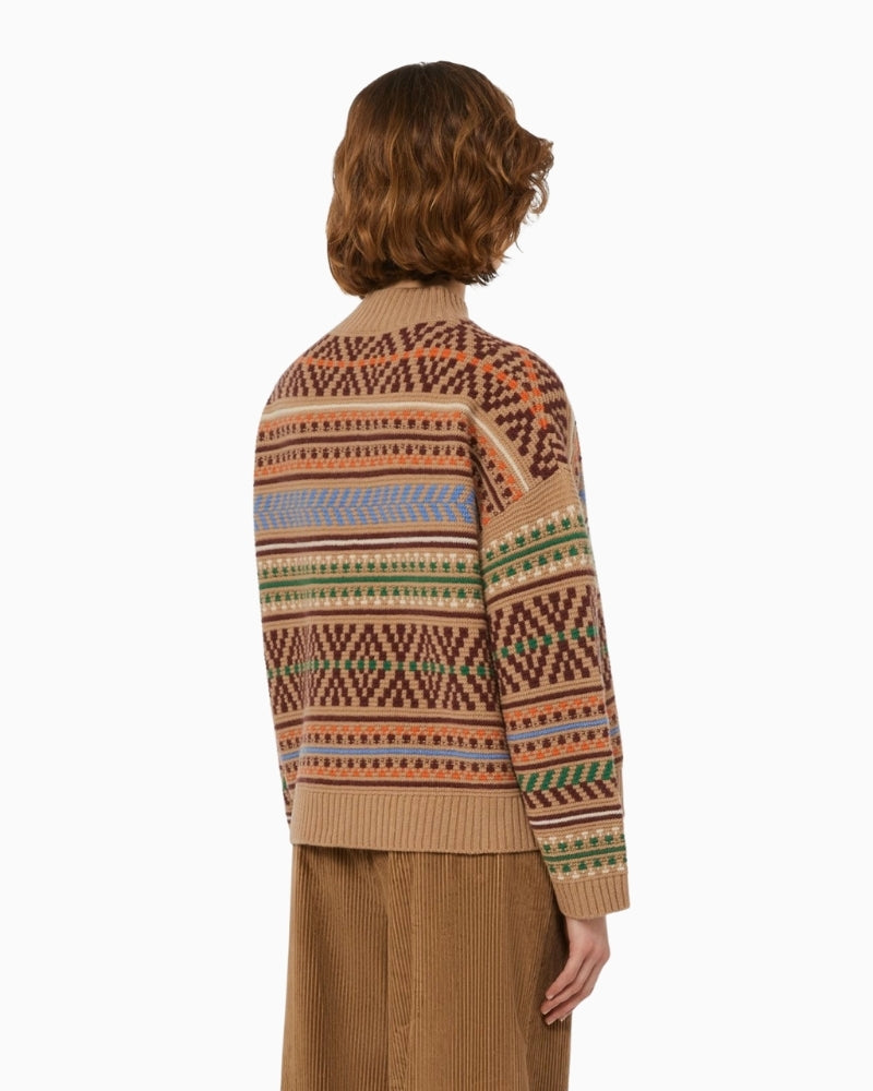 Back view of loose-fit jumper showing side slits and ribbed hem