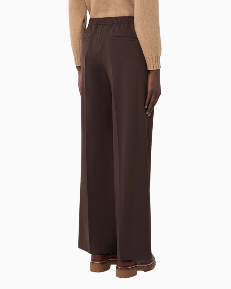 Back view of stretch wool Petra trousers with welt pockets