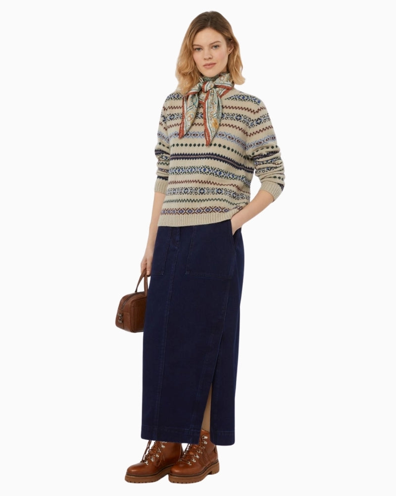 Model wearing ecru Quirite jumper styled with tailored trousers for a smart casual look