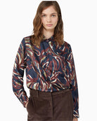 Close-up of shirt collar and cuffs with mother-of-pearl button detailing