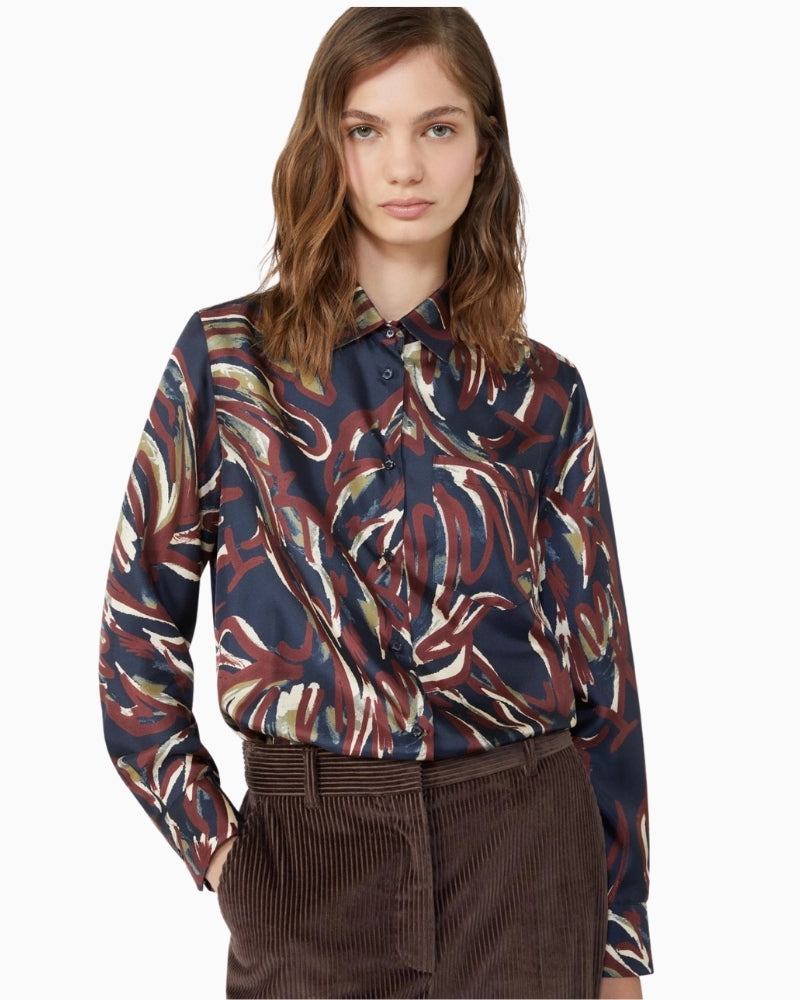 Close-up of shirt collar and cuffs with mother-of-pearl button detailing