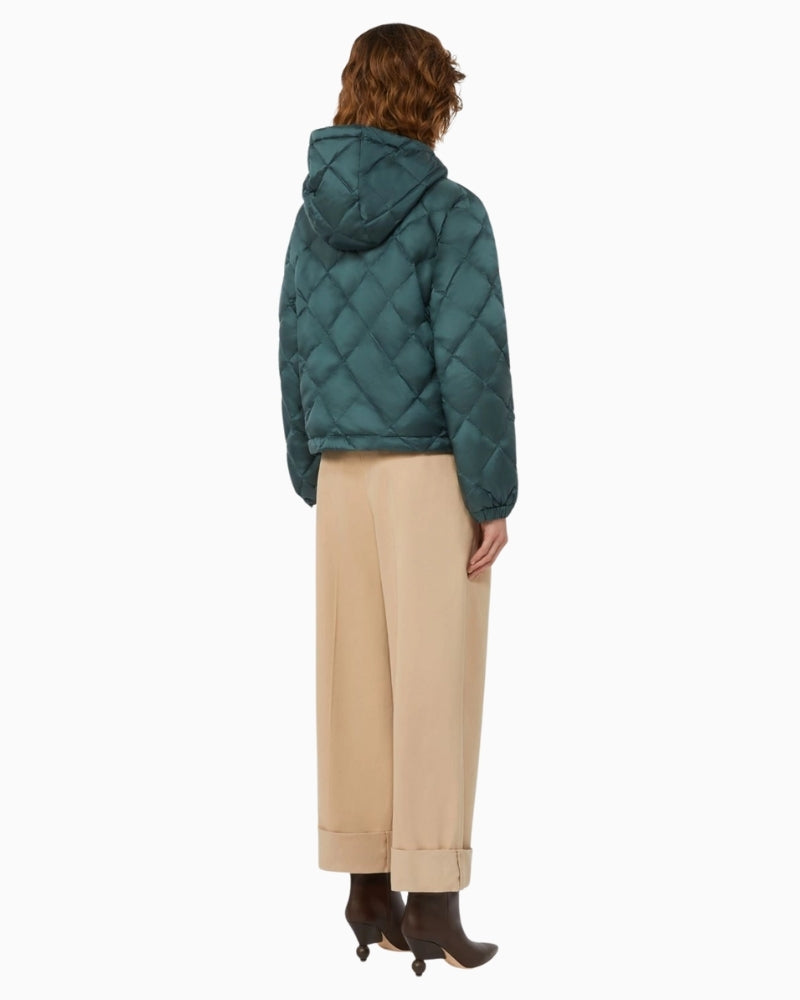 Back view of boxy hip-length goose down jacket showing quilted pattern and hood