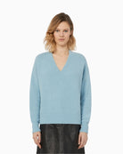 Front view of light blue alpaca blend V-neck jumper by Weekend Max Mara with relaxed fit and ribbed edges