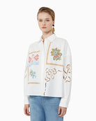 Woman wearing Weekend embroidered cotton poplin cropped shirt, slight side view – Áines Boutique