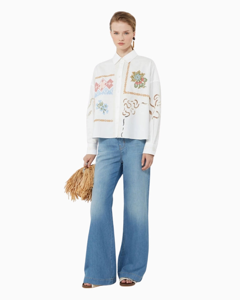 Woman wearing Weekend embroidered cotton poplin cropped shirt, styled with wide leg jeans – Áines Boutique