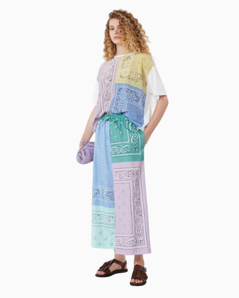 Woman wearing Weekend Max Mara multicolour T-shirt styled with trousers – Áines Boutique