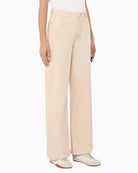 Woman wearing Weekend Max Mara wide-leg cotton trousers sand, side view – Áines Boutique