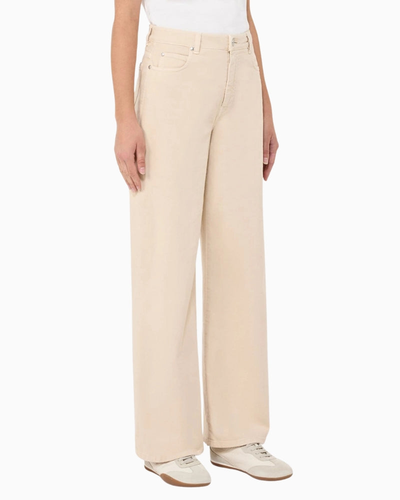 Woman wearing Weekend Max Mara wide-leg cotton trousers sand, side view – Áines Boutique